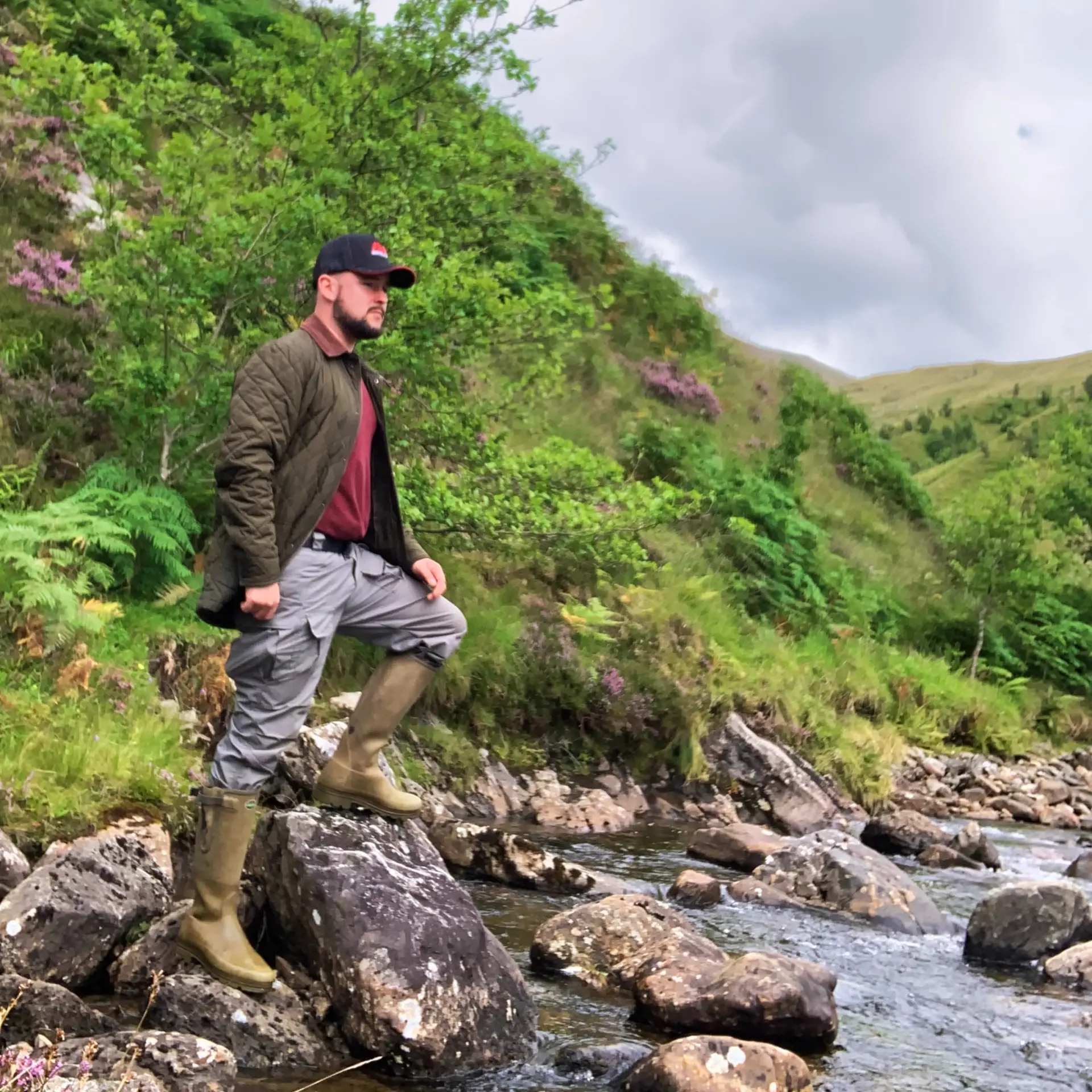 Alexander Bennett walking beside a stream
